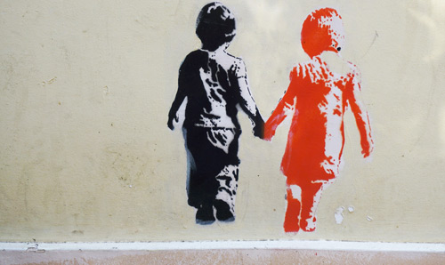 A Banksy-style image of two children holding hands