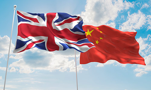 A British and Chinese flag next to each other. 