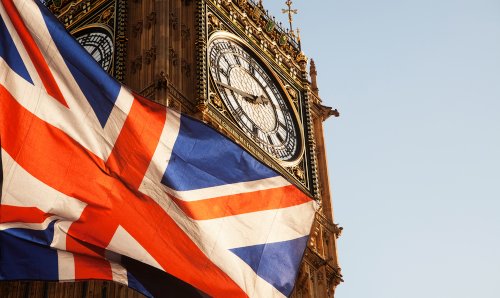 An image of the union jack flag next to Big Ben.