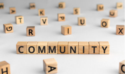 wooden blocks spell out the word community
