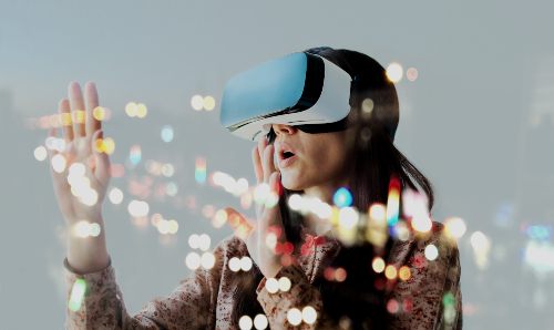 A woman wearing a virtual reality headset.