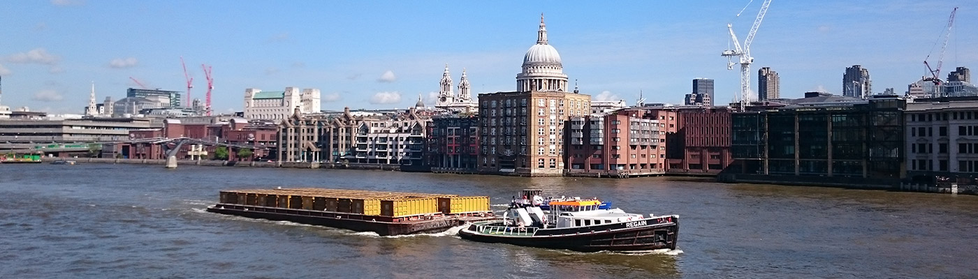 cargo ship on the River Thames, London