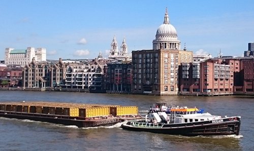 A cargo ship on the River Thames.