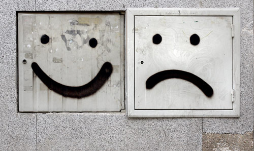 A smiley face and a sad face
