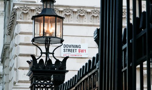 The Downing Street sign on a building in London. 