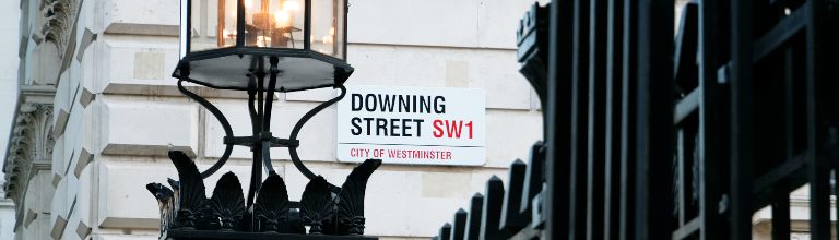 The Downing Street sign on a wall.
