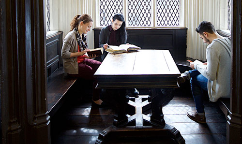 Students studying in a library environment